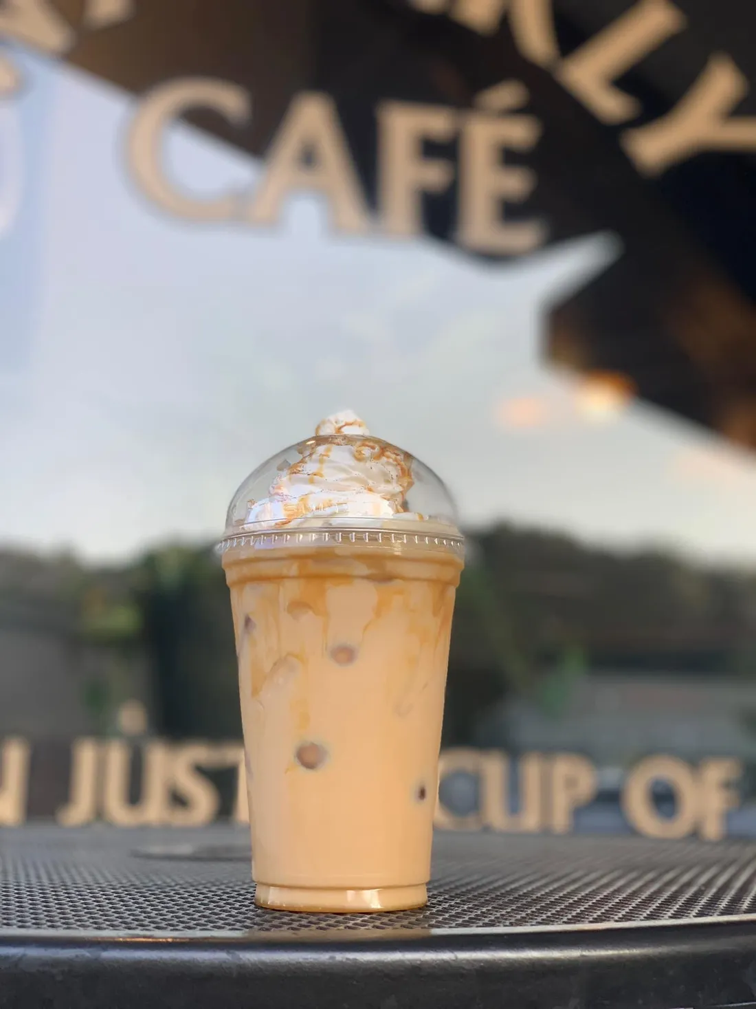 An iced coffee at the Waverly Cafe window
